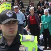 Demonstration with four people in handcuffs