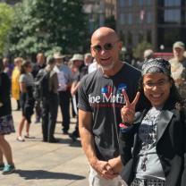 White guy and Latina woman smiling for the camera