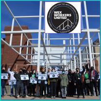 Workers holding signs outside the Wexner Center