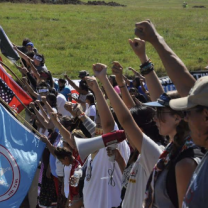 People standing with fists in air