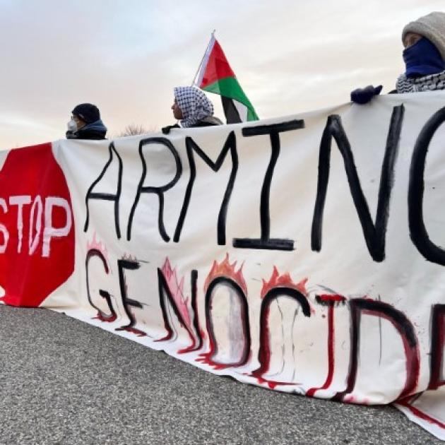 Banner saying Stop Arming Genocide