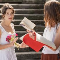 Young woman interacting with another young woman