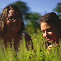 Two young women out in a field