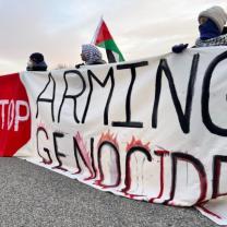 Banner saying Stop Arming Genocide