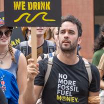 Man holding protest sign